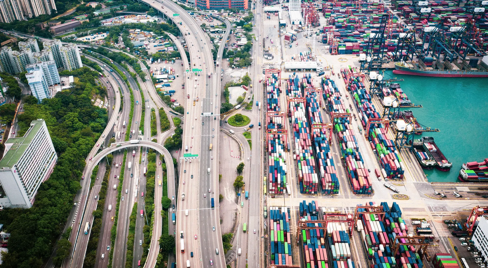 Aerial view of a container port and highway interchange